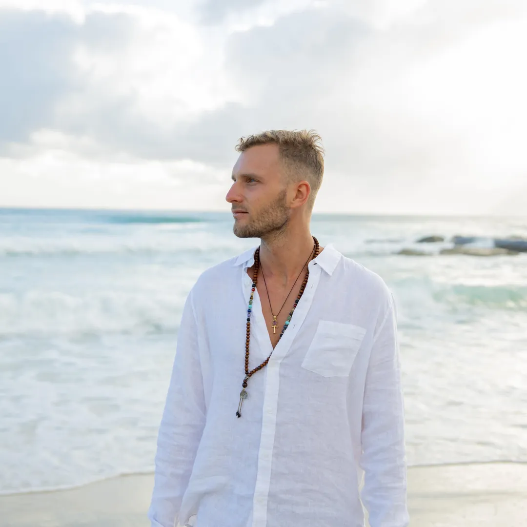 Person in white shirt on a beach